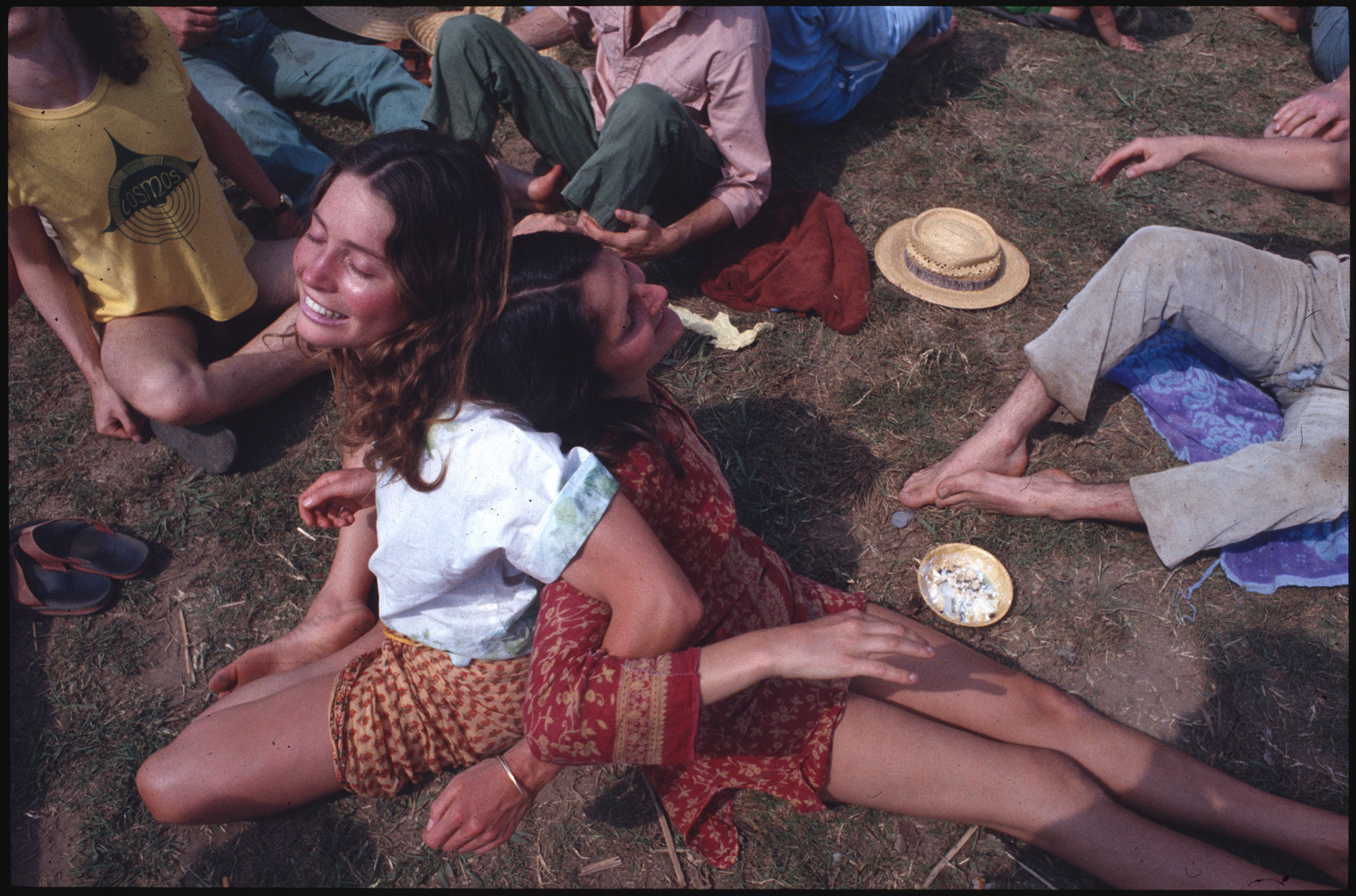 Two women embracing at a festival