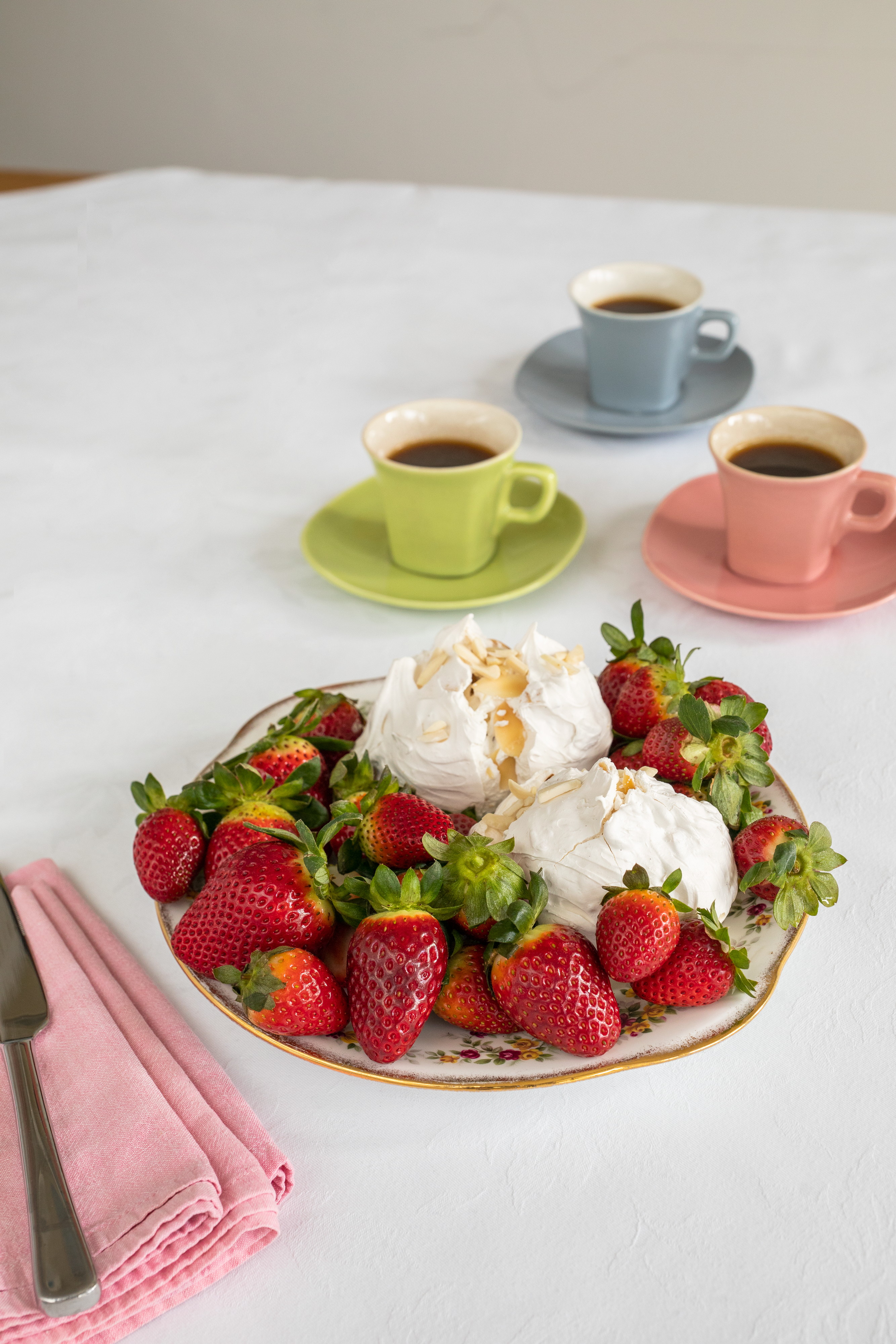 Photo of table set with meringues and tea cups