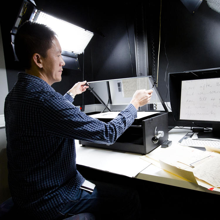 Conservator scanning in several manuscripts