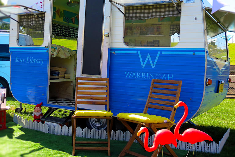 Blue caravan with library signs on it - Warringah pop-up library