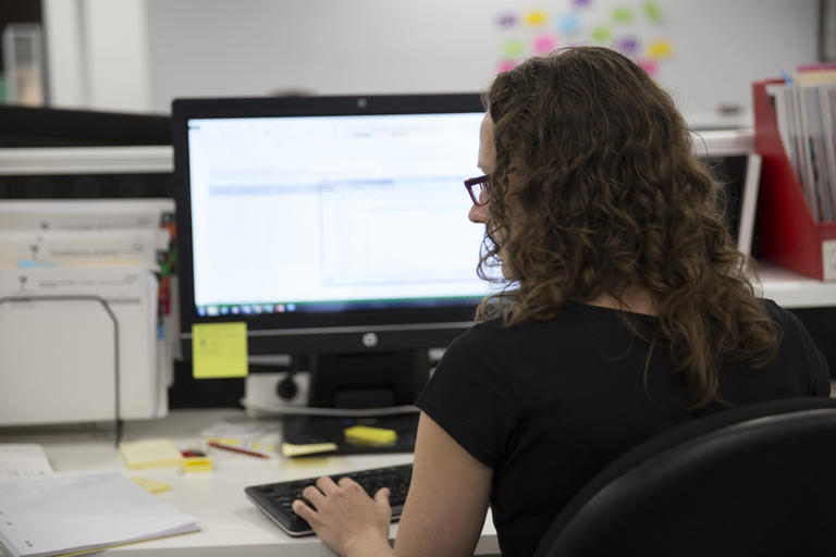 Woman working on desktop computer