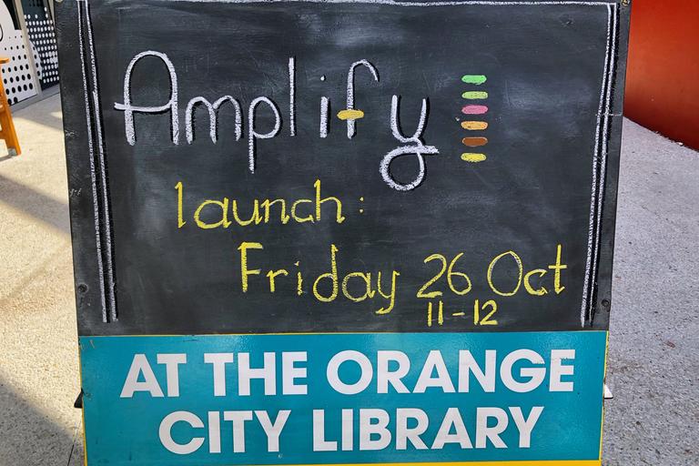 Sign from Amplify launch at Orange City Library