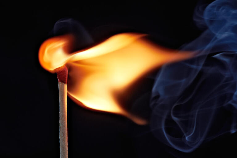 A burning match