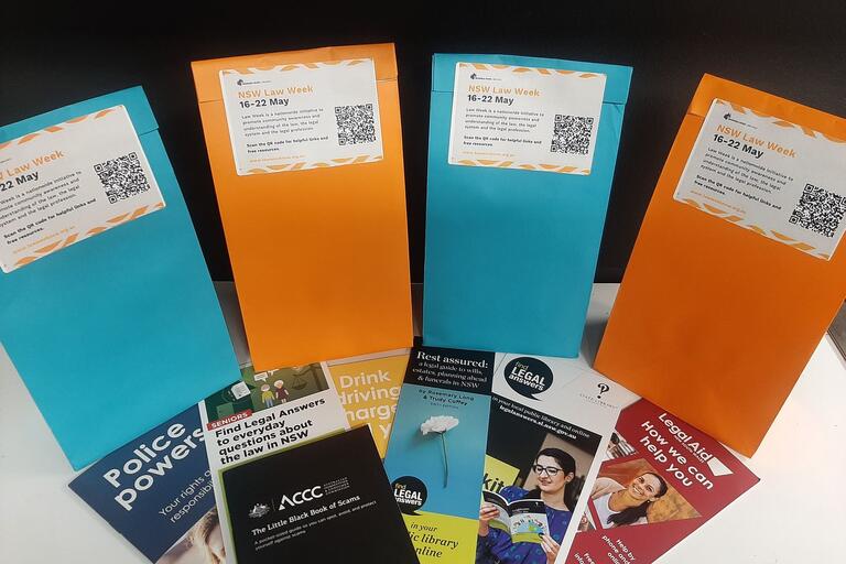 A display of coloured showbags, bookmarks and brochures